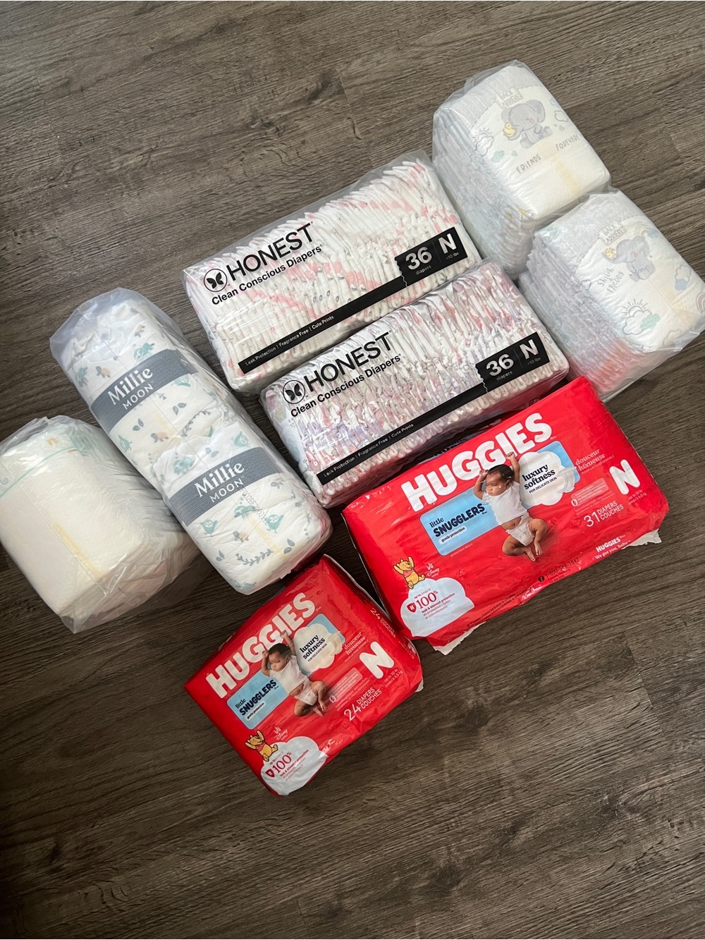 8 packs Brand New, Newborn Diapers - Assorted Brands 1 opened but too small